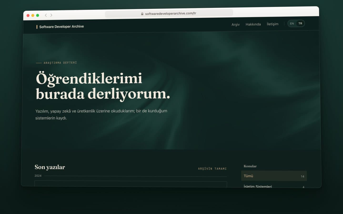 Still from the softwaredeveloperarchive.com animation: the Turkish home page with the research notebook's headline, “Öğrendiklerimi burada derliyorum.” (What I learn, I collect here.)